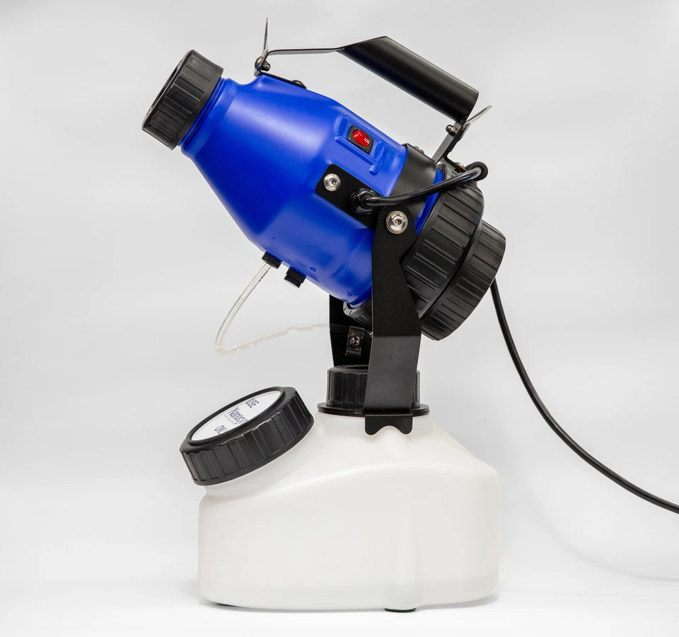 Handheld misting machine